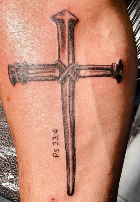 Nails Cross Tattoo On Arm